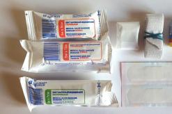 What is included in a car first aid kit and what is its expiration date?
